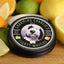 Photo of Charming Charlie’s Magical Beard Balm – Tighty Whities  A beard balm tin sits on a wood cutting board surrounded by lemons, limes and other fruit.